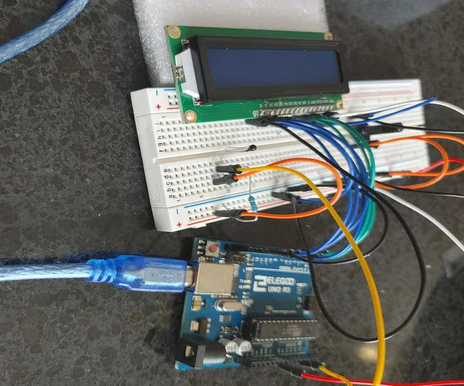 The first prototype on a breadboard: an Arduino Uno wired to an LCD display and sensors with jumper wires