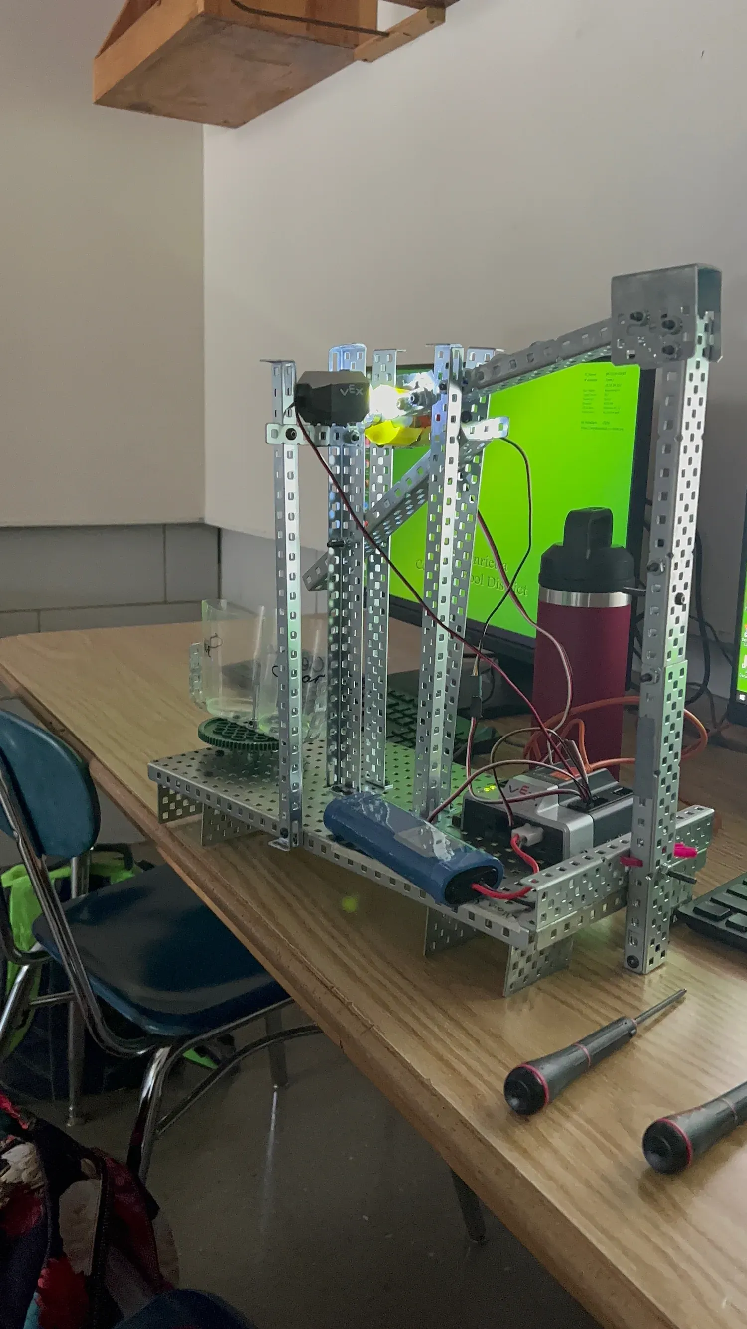 Assembled VEX marble sorter viewed from a second angle, showing the light sensor, wiring to the VEX microcontroller, and battery mounted along the frame